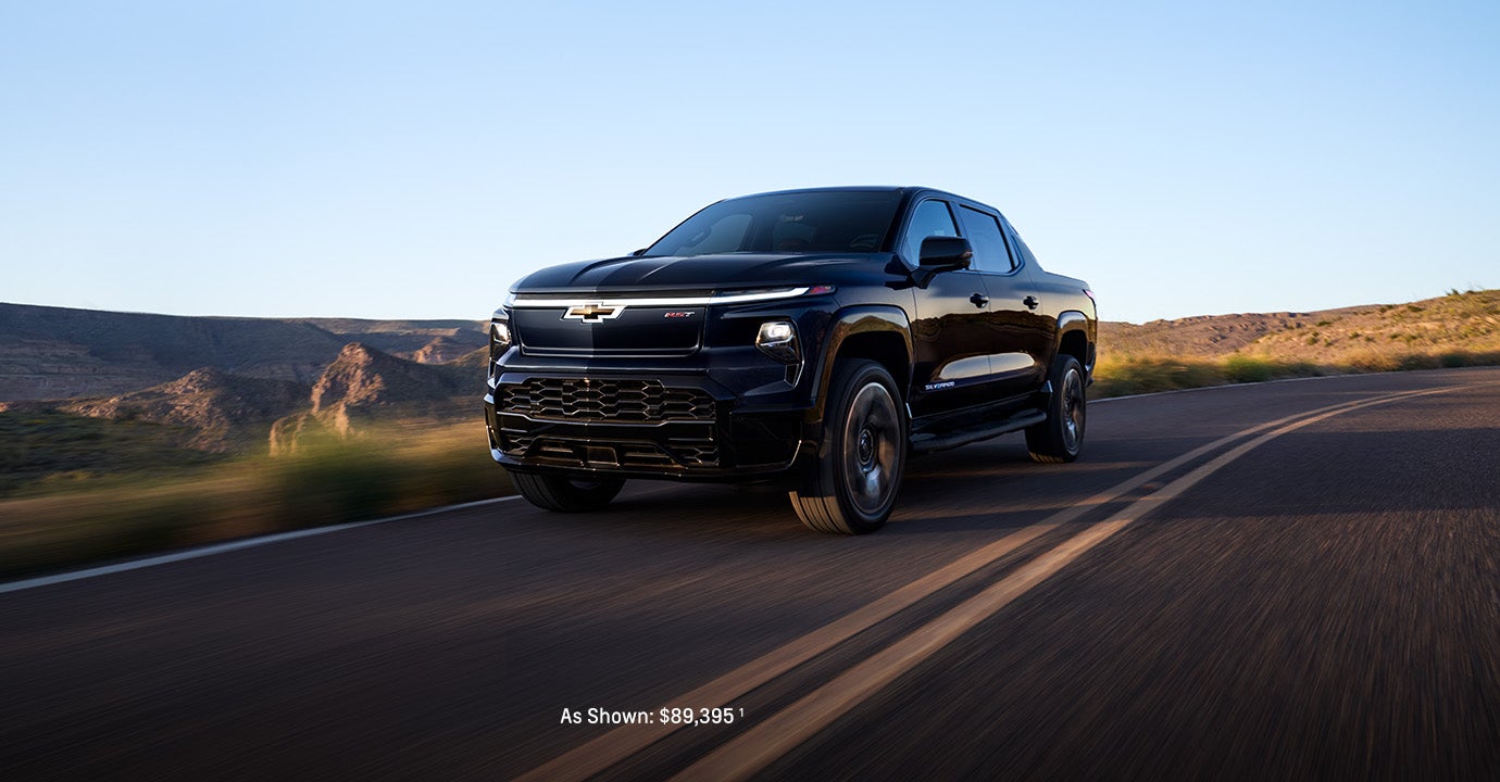 2025 black Silverado EV running on road
