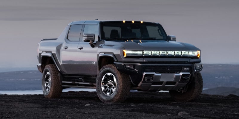 GMC Hummer EV parked on rugged terrain